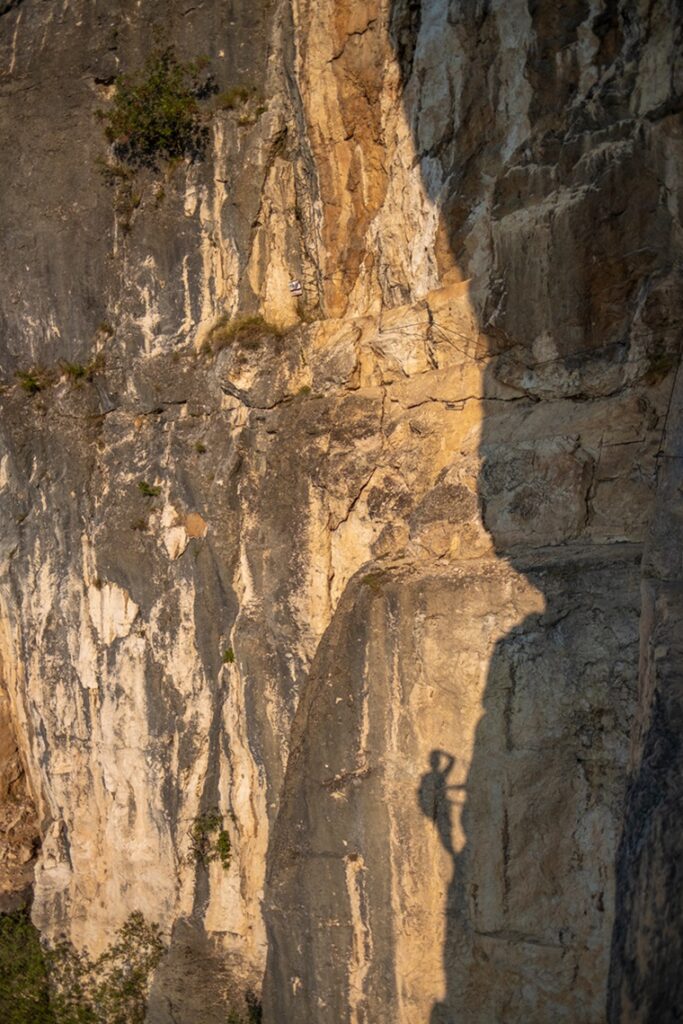 Shadow,Of,A,Climber,On,A,Vertical,Rock,Wall.,Via