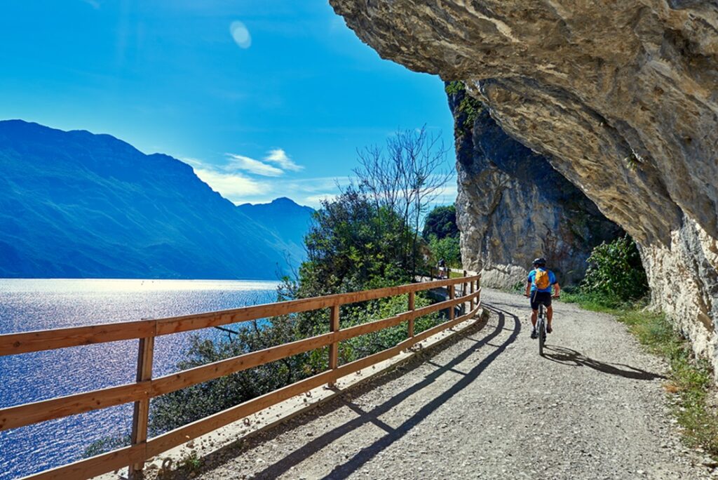 Bicyclists,Riding,A,Bicycle,On,The,Ponale,Street,In,Riva