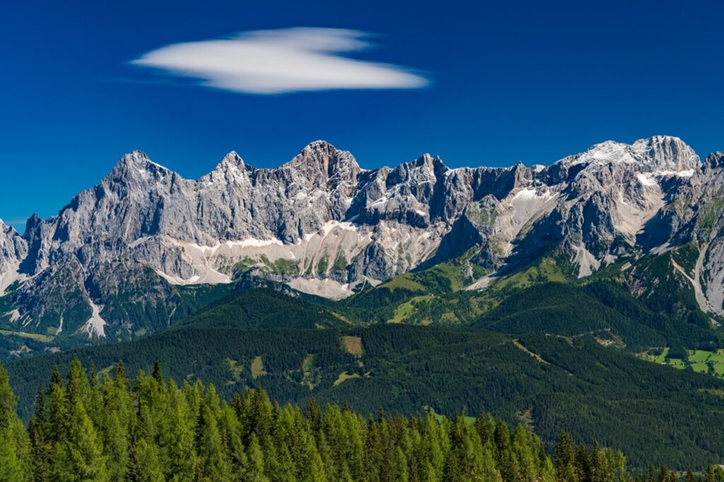 Hohe,Dachstein,Mountain,Range,In,Austria,With,Green,Trees,In