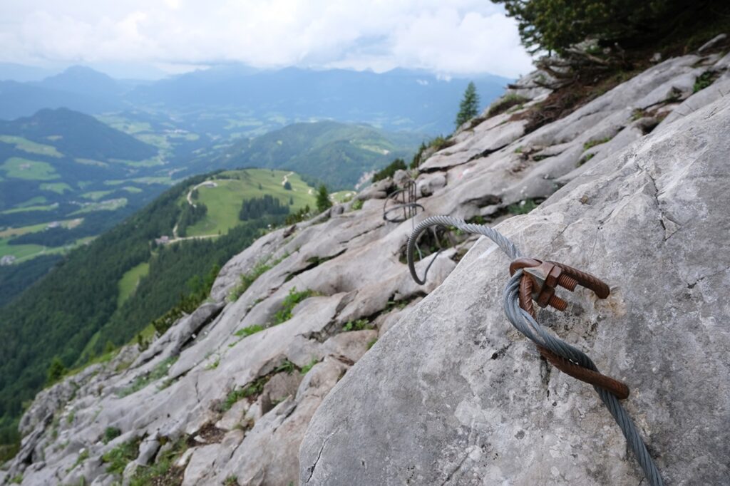 Close,Up,Of,Metal,Rope,Insurance,On,Rocks,On,Tourist