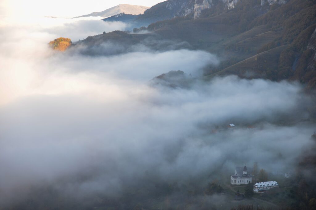 The,Morning,Clouds,Rise,Over,The,Sub,Piatra,Monastery,In