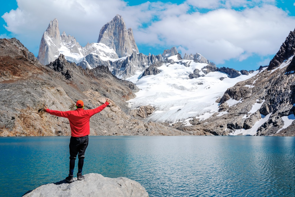 A,Young,Man,Standing,With,Open,Arms,Staring,At,Monte