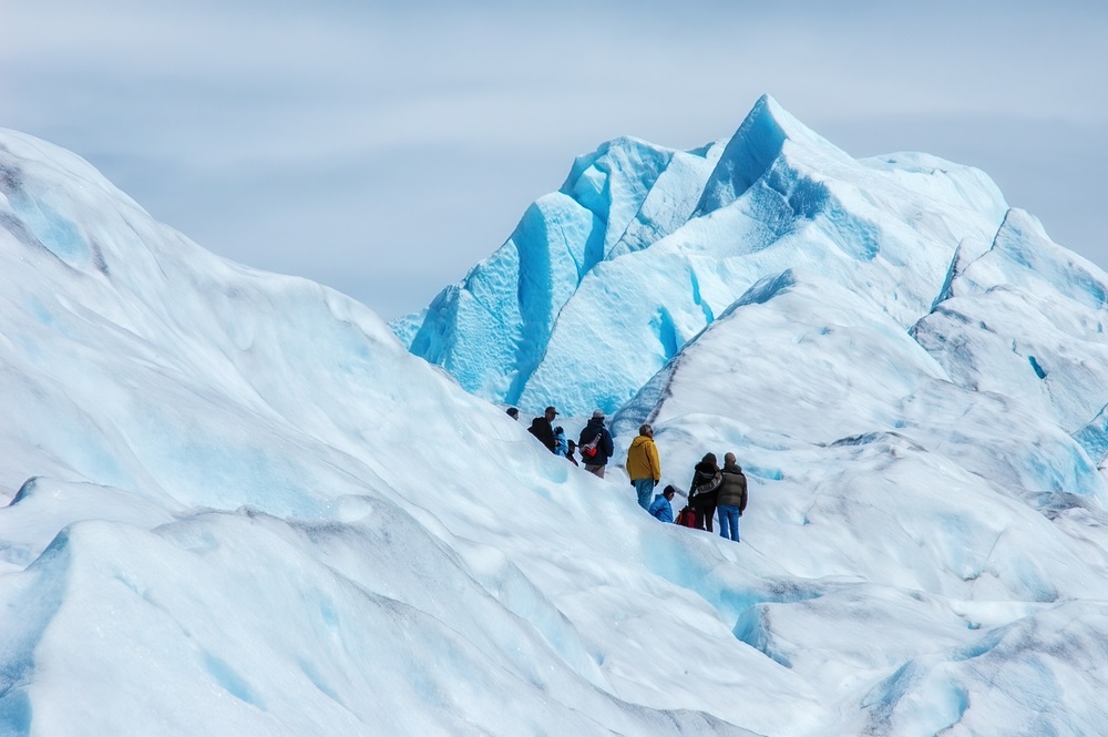 Tourists,Trekking,On,Perito,Moreno,Glacier,In,Los,Glaciares,National