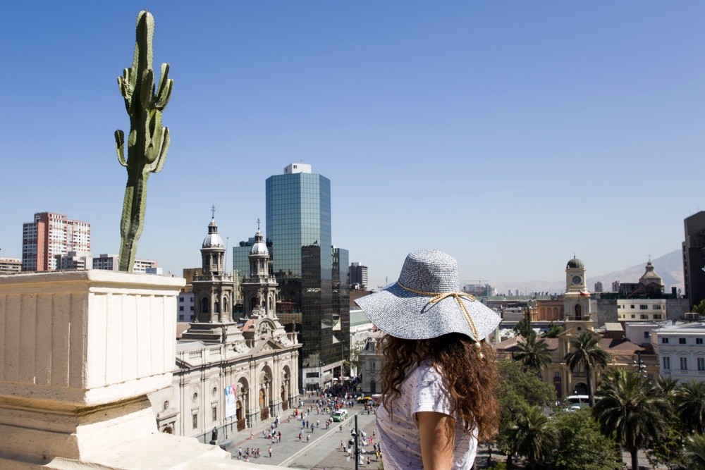 Young,Woman,With,Hat,Looking,At,Santiago,Chile,On,A
