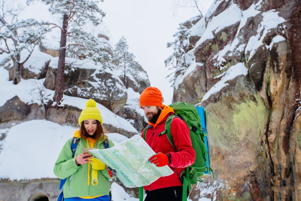 Couple,Of,Travelers,Man,And,Woman,With,Backpacks,Orient,Themselves