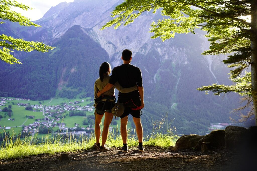 Sporty,Couple,With,A,Via,Ferrata,Climbing,Equipment,Looking,At